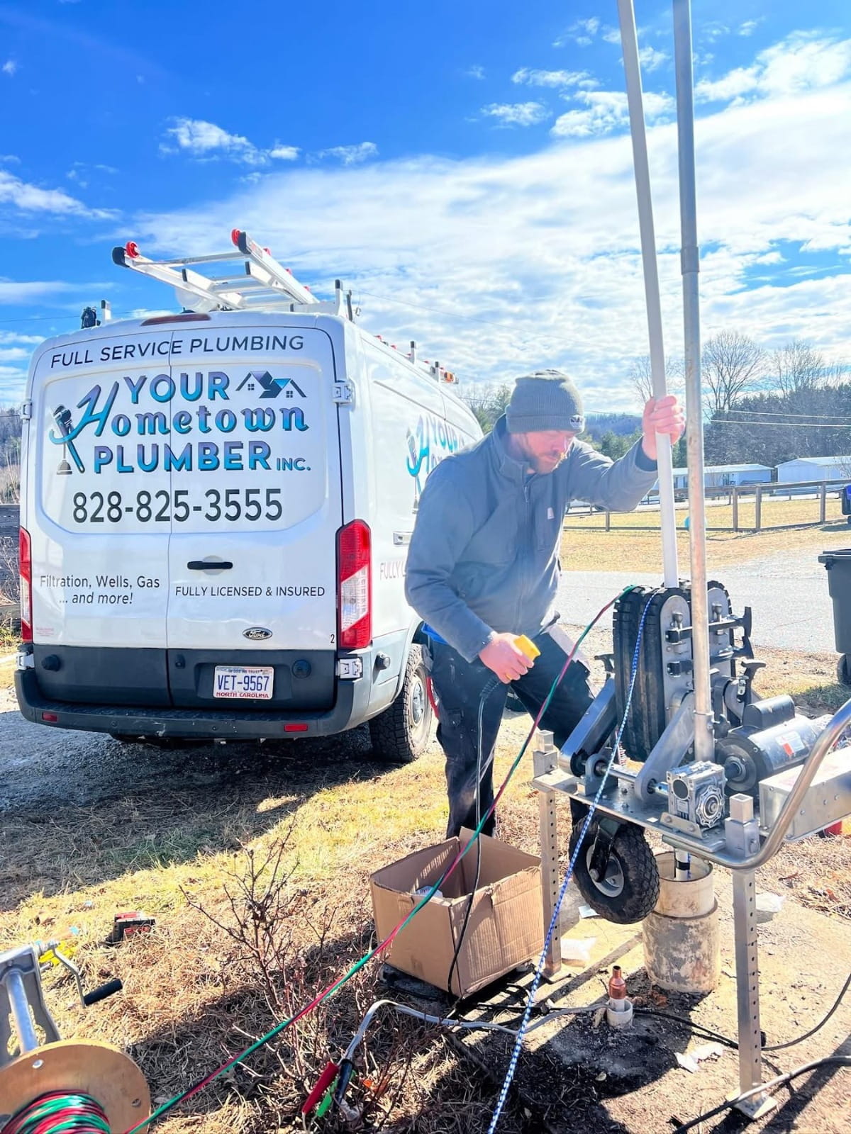 Your Hometown Plumber technician performing well pump service in Western NC