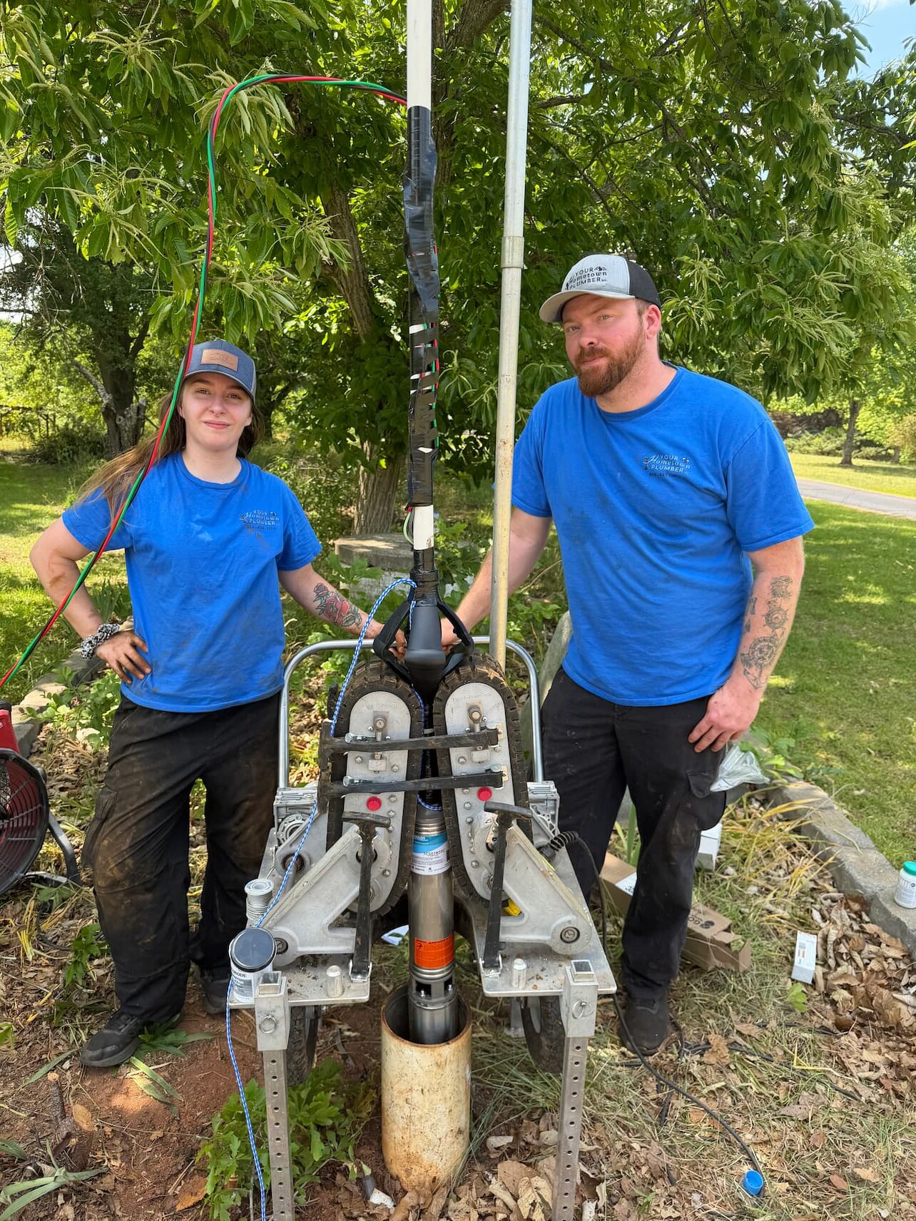 Your Hometown Plumber team installing submersible well pump in Western NC